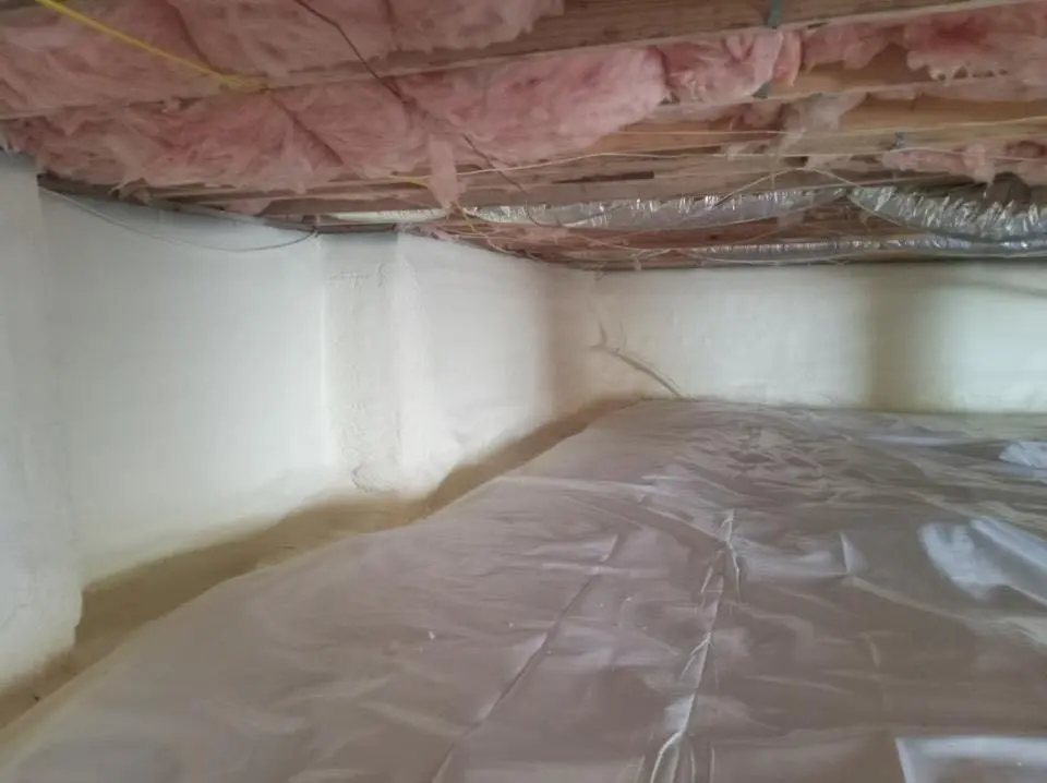 Crawl space encapsulation with closed-cell spray foam for Storm Damage Roof Repair in Port Jefferson